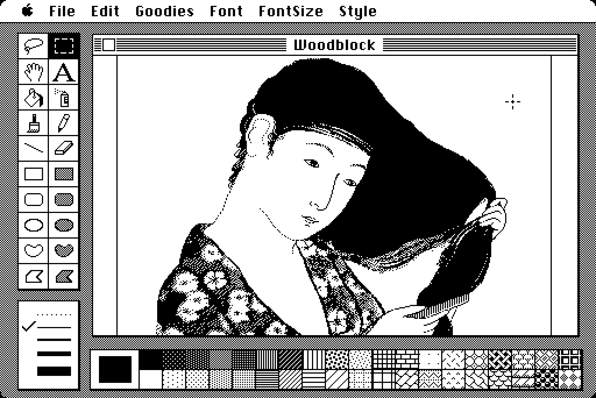 A screenshot of MacPaint with the famous Susan Kare woodcarving